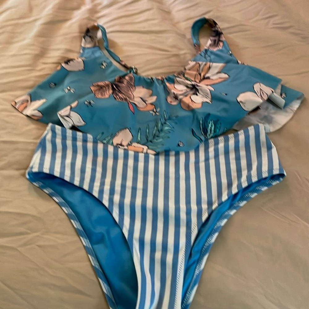 Cute blue bikini with floral ruffled top and striped bottom